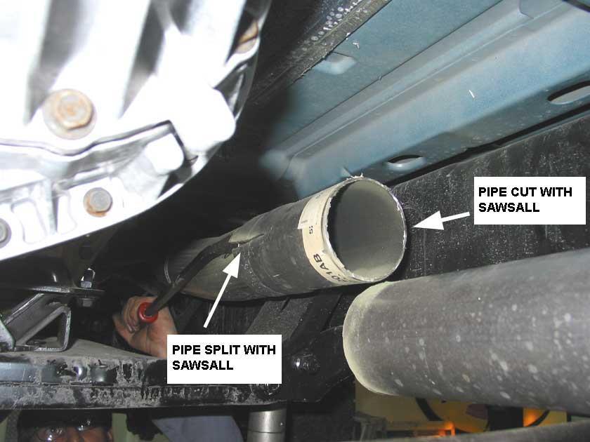 Remove the exhaust clamp that holds the intermediate pipe to the down pipe at the first cross member.