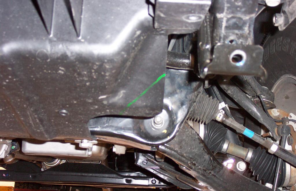 Remove only the front two 13mm (head) bolts attaching the center splash shield to the
