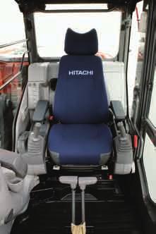 Three switches on the lever (optional) can be set to operate attachments other than buckets. The cab is pressurized to keep out dust.