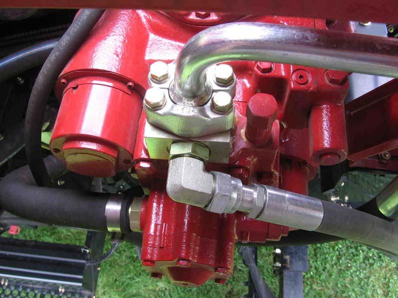 Install the long manifold adapter block between the pump and the flange connection on the bottom of the pump with four supplied 7/16 x 5 ½" bolts.