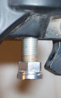 about 1mm below the bottom of the threaded