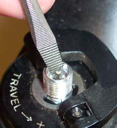 screwdriver to depress the Schrader valve and