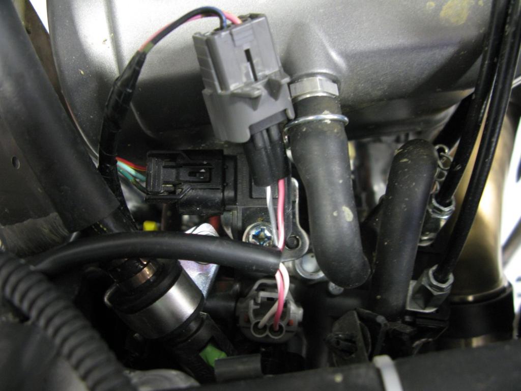 Locate the fuel injector (photo 1), disconnect the stock and connect the MX harness in-line with the fuel injector