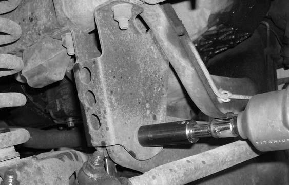 Working on the front driver side twin eye beam axle bracket, remove the stock bracket from