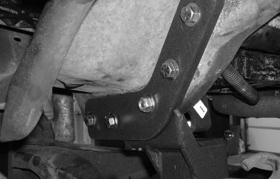 14. Locate the new rear twin eye beam axle pivot relocation 15. Working on the driver side, carefully drill out the frame bracket and new support bracket.