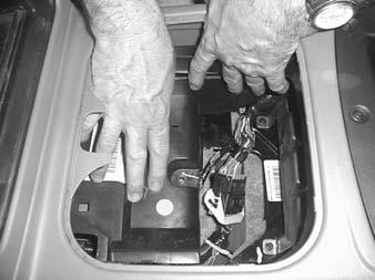 Reconnect the ground wire to the negative side of the battery. Follow next step (STEP 11) and then repeat procedure to remove the front seats.