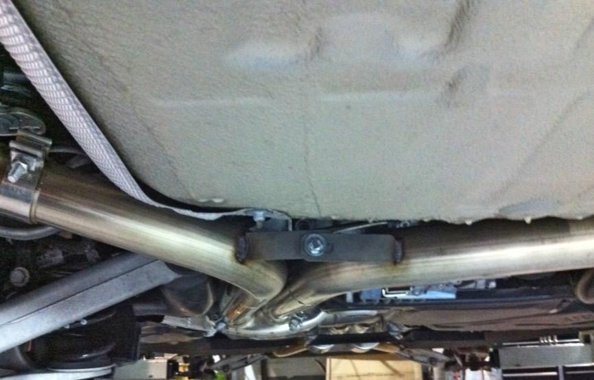 Next install the mid-muffler section, re-using the factory sleeve clamps, making sure the muffler inlets/outlets are