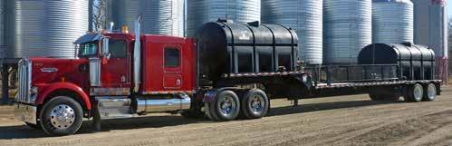 pneu packers, 800 bu tow-behind tank, s/n 111091, dbl fan, 10 in. load auger, ground drive, high flotation, hyd bag lift, 30.5Lx32 duals.