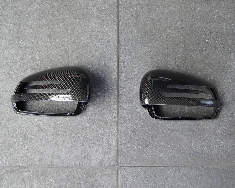 212,60 mirror covers in clear-coated Carbon black for AMG
