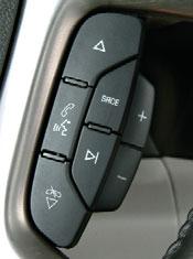 15 SRCE (Source): Press this button to switch between AM, FM, XM, CD and AUX. Press and hold this button for one second to initiate the navigation system voice recognition.