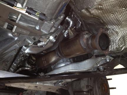 10. Remove the front downpipe first by snaking it past the subframe. 11.