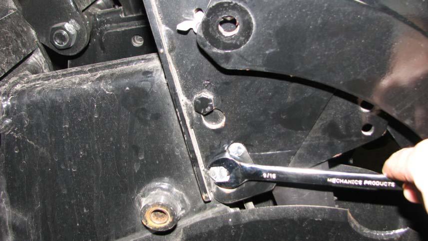 Step 1: Lower press wheel arms by removing ½ bolt from rear ½ bolt to be removed press