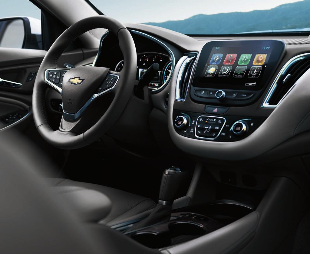 Malibu Premier interior in Dark Atmosphere/Medium Ash Gray with available features. EASY ACCESS TO YOUR SMARTPHONE. MYLINK. YOUR WAY. Available Chevrolet SHOP YOUR APPS.