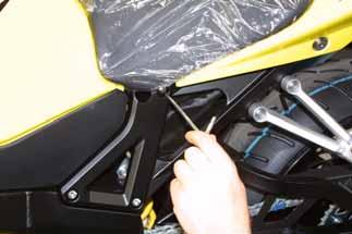 To uplift the gas tank, is first of all necessary to remove the driver s seat, that is fixed to the bike s chassis with two screws.