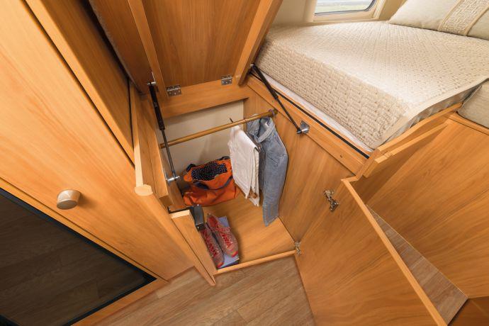 Generously sized bed Space for your holiday wear The double bed in the HYMER ML-T 560 virtually fills