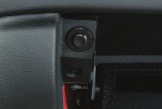 To unlatch the trunk, lift the head restraint and pull the yellow ring (shown below) toward the front of the vehicle.