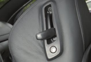 The power front seat controls are located on the outboard side of the driver and passenger seats.