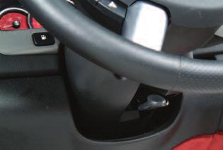 Adjust the manual lumbar control to the desired amount of support in the lower seatback by turning the knob on the outboard side of the seat cushion.