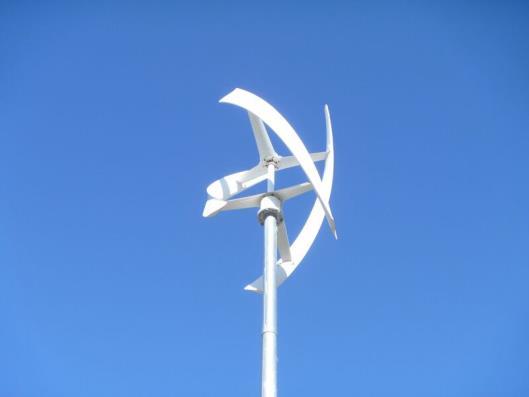 The 1 kw vertical-axis wind turbine also is of three blade type and used a dump load for power regulation and a short-circuiting breaker to protect the electrical installation from overvoltages