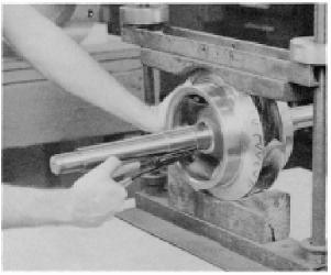 Remove the impeller retaining ring (3-915- 1) with a retaining ring pliers (Figure 32). Heat the impeller hub on both ends to 350 F maximum, and pull or push the impeller from the shaft.