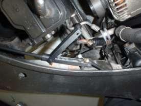 16. Disconnect the bonnet pull cable. The junction box is above the left-hand headlight.