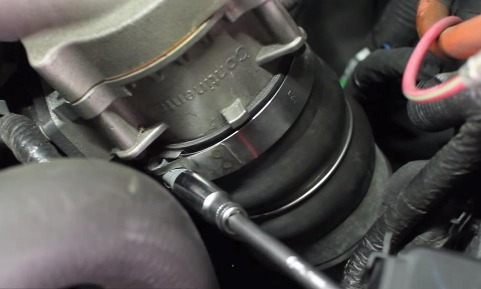 Loosen the clamp that secures the hot-side intercooler pipe to the turbocharger outlet.