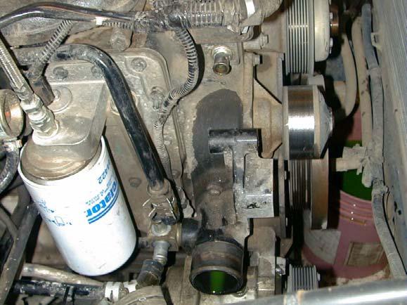 11. Remove the coolant return hose from the transmission cooler at the square block tee connector (Figure 1.2).