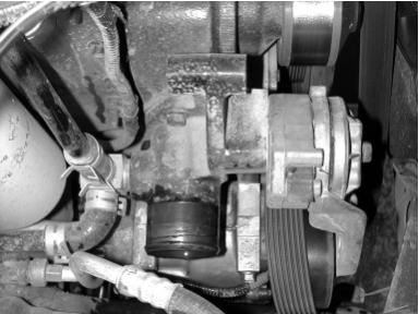 On automatic transmission vehicles, remove and discard this hose and metal line. On manual transmission vehicles, remove the blanking plug from this location.