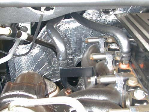 the exhaust manifold). Install a hose clamp and tighten. Route the hose forward and down beside the engine oil filter. 2. On manual transmission models (Figure 1.