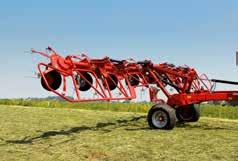 The long carriage frame links the tedder to the tractor and serves as a transport carrier.