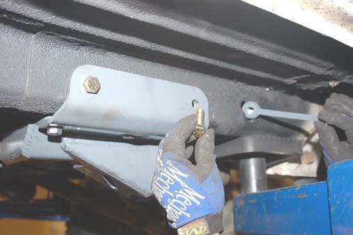 in the rear holes using a 3/4 wrench. See Photo 15. 23.