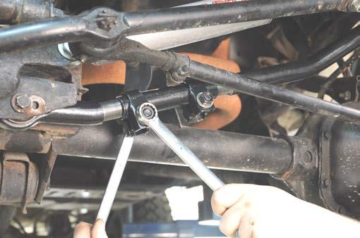 If axle is centered, tighten the clamps on the adjustment collar with 11/16 and 5/8 wrenches. See Photo 26. 41. Tighten the axle and frame end using a 15mm wrench / socket.