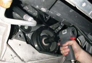 Remove the front harmonic balancer bolt using a 24mm impact socket and a ½