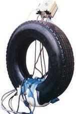 Swinging Pressure Screw and Heating Assembly applies air pressure and heat to the tire with it hanging in perpendicular position.
