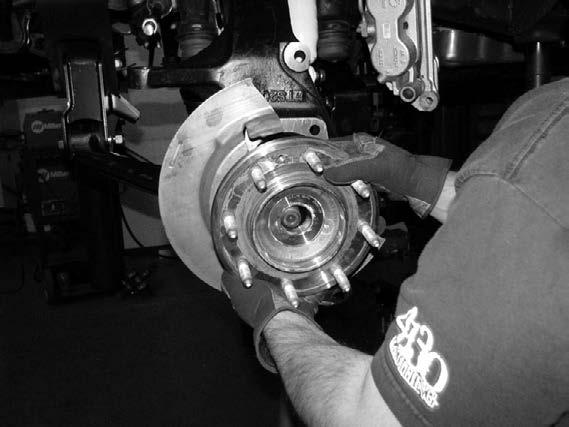 Install the rotor and the small bolt retaining the rotor and torque 12 ft-lbs.