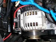 Put the bolts through the two side-mounting tabs on the compressor bracket (D) and into the front and rear of the alternator bracket (Figure 10). Figure 9 5. Tighten all hardware securely.