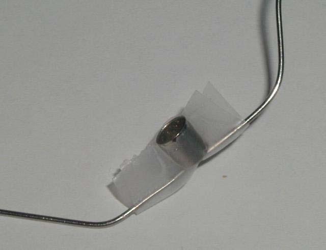 Click on the image for a larger picture Attach the metal cap to the center of the wire with tape.