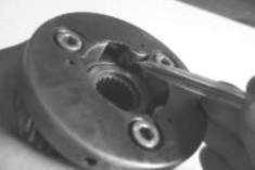 The starter clutch follows conventional Japanese design. These three rollers are fitted in wedge-shaped slots, and held outwards by small springs and plungers.