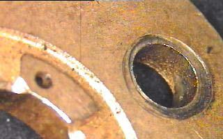 Genuine bearing has location diameter for bolt plus larger