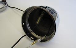Park the motorcycle on a hard, level surface; turn off the ignition and allow the engine to cool. STEP 2 As shown in PIC 1, remove the Button Head Cap Screw Located at the bottom of the light housing.