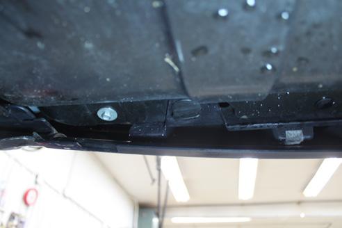 Underneath the bumper, remove the two (2) push pins.
