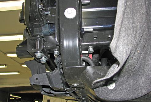 Remove the tow hook bracket from the vehicle. Do this on both sides of the vehicle. 7.