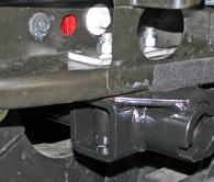 Models equipped without tow hooks: Slide the baseplate into position on the frame.