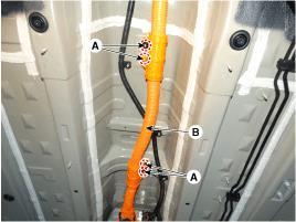 Vehicle Underside An orange colored cable covered by the under cover