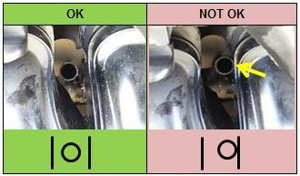 Check for interference between the dipstick tube and the intake manifold. Adjust the dipstick tube to create clearance between the tube and manifold if necessary.