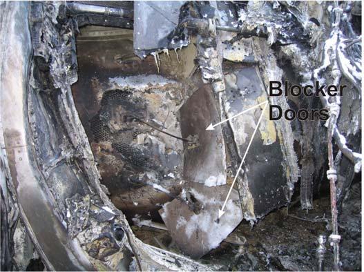 The thrust reverser outboard transcowl remained attached but was dislodged from the outboard half of the thrust reverser actuation ring. The outboard transcowl was damaged and had been pushed aft.