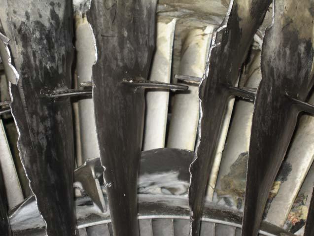The majority of the fan blade leading edge tips were bent aft with four (4) consecutive blades (Nos.