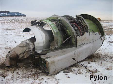 1 engine was found detached from the airplane and was resting on its right-hand side to the left of its installed position on the left wing (PHOTO 1).