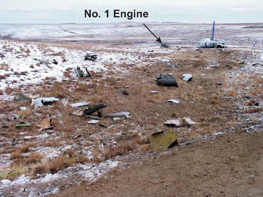 NTSB NO: DCA-09-MA-021 Ground scars were located north of taxiway WC between taxiway WC and Kewaunee Street that were consistent in size and shape with the engine cowlings and on the south side of