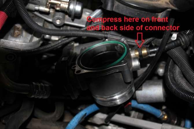 on the back side. b. Disconnect the vent line from the throttle body.